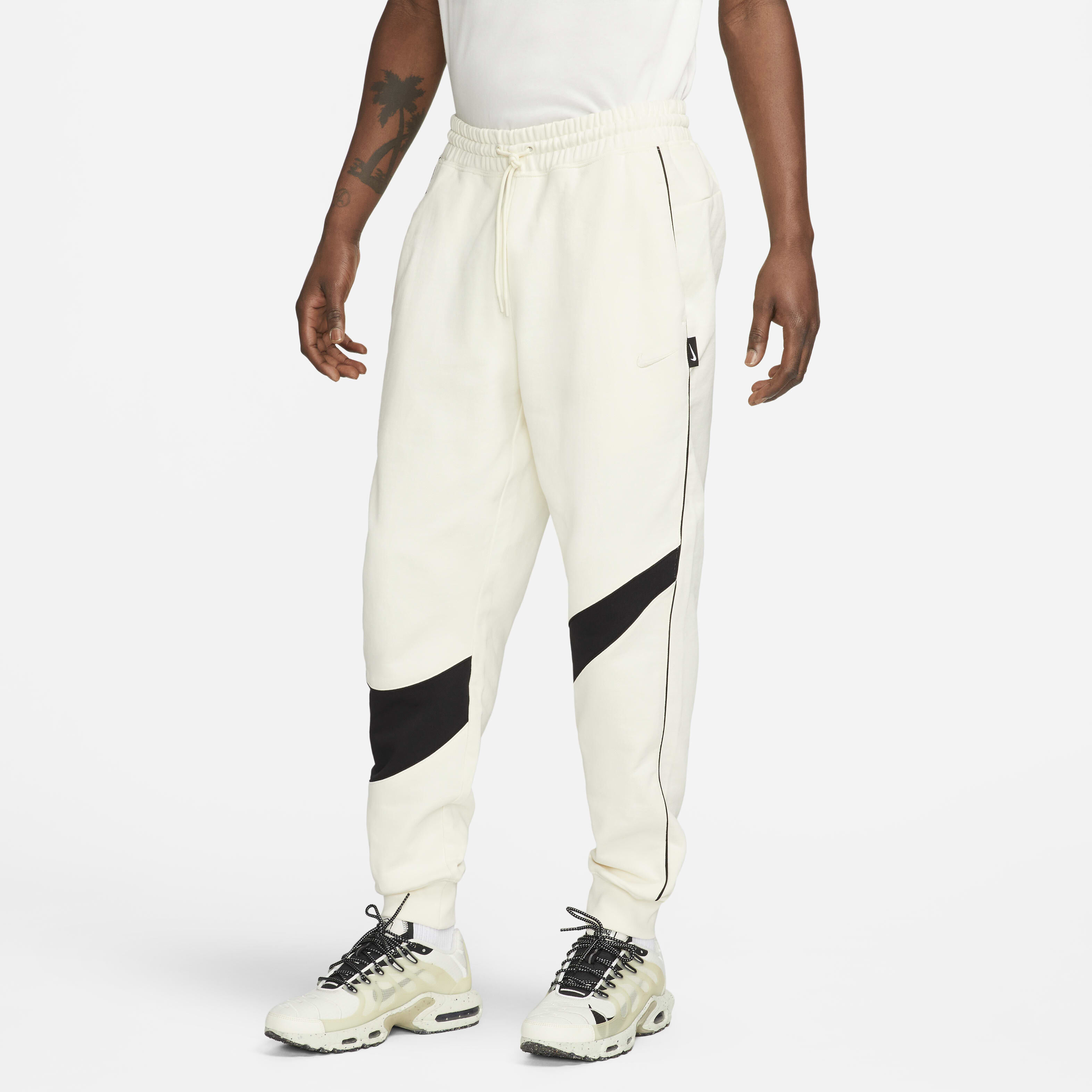 Buy Nike Swoosh Men s Fleece Trousers Coconut Milk Black Coconut Milk Nike UAE Official