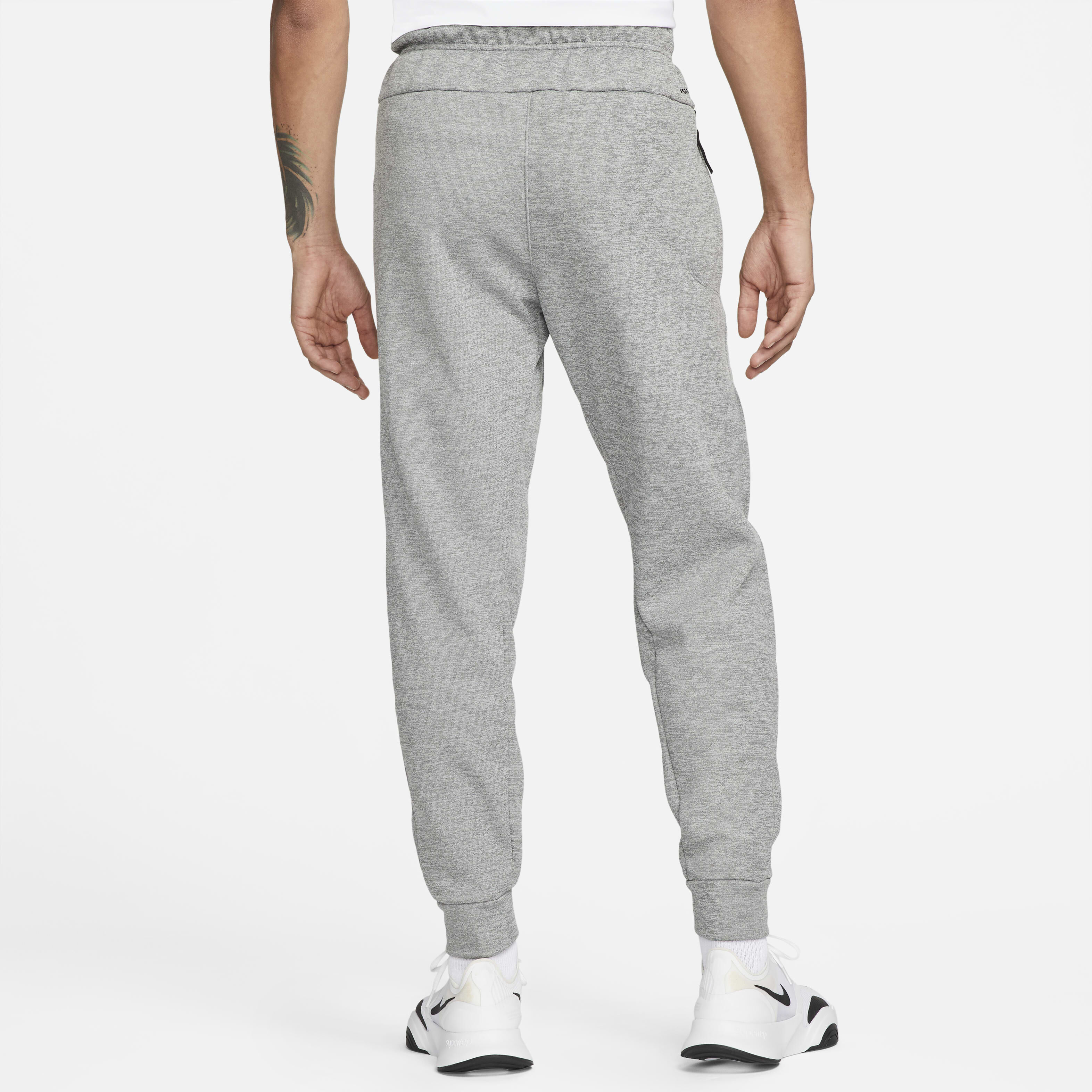 Buy Nike Therma Men s Therma FIT Tapered Fitness Trousers Dark Grey Heather Particle Grey Black Nike UAE Official