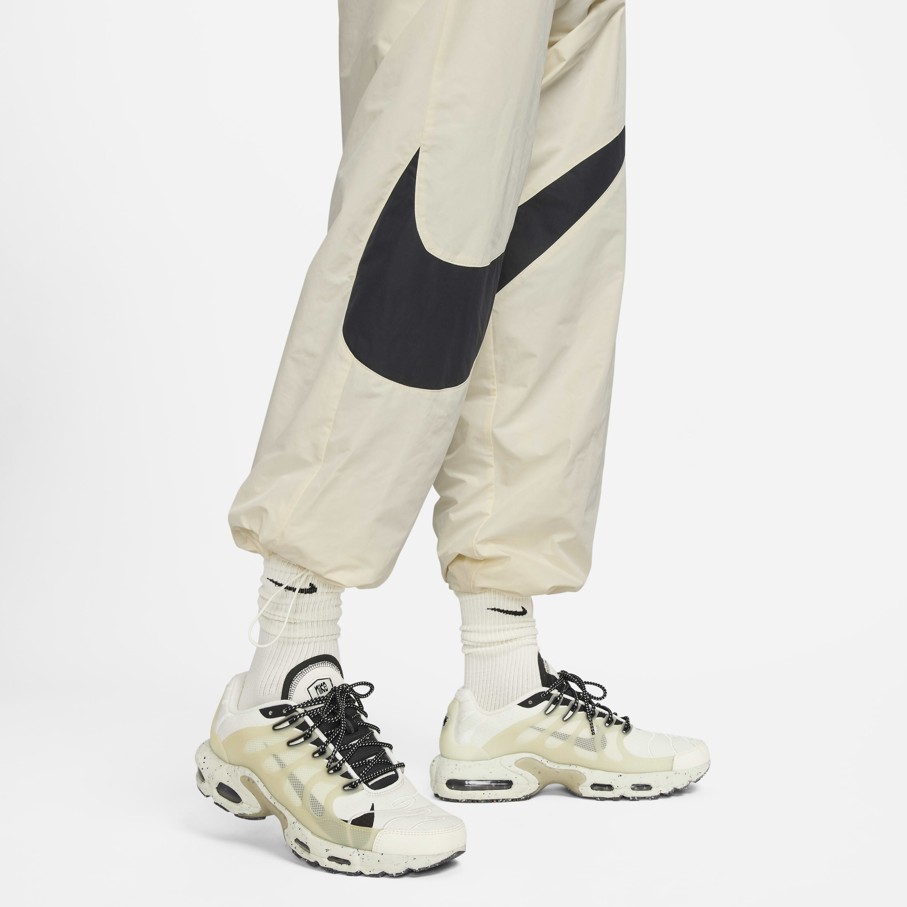 Buy Nike Swoosh Men s Woven Trousers Coconut Milk Black Coconut Milk Nike UAE Official