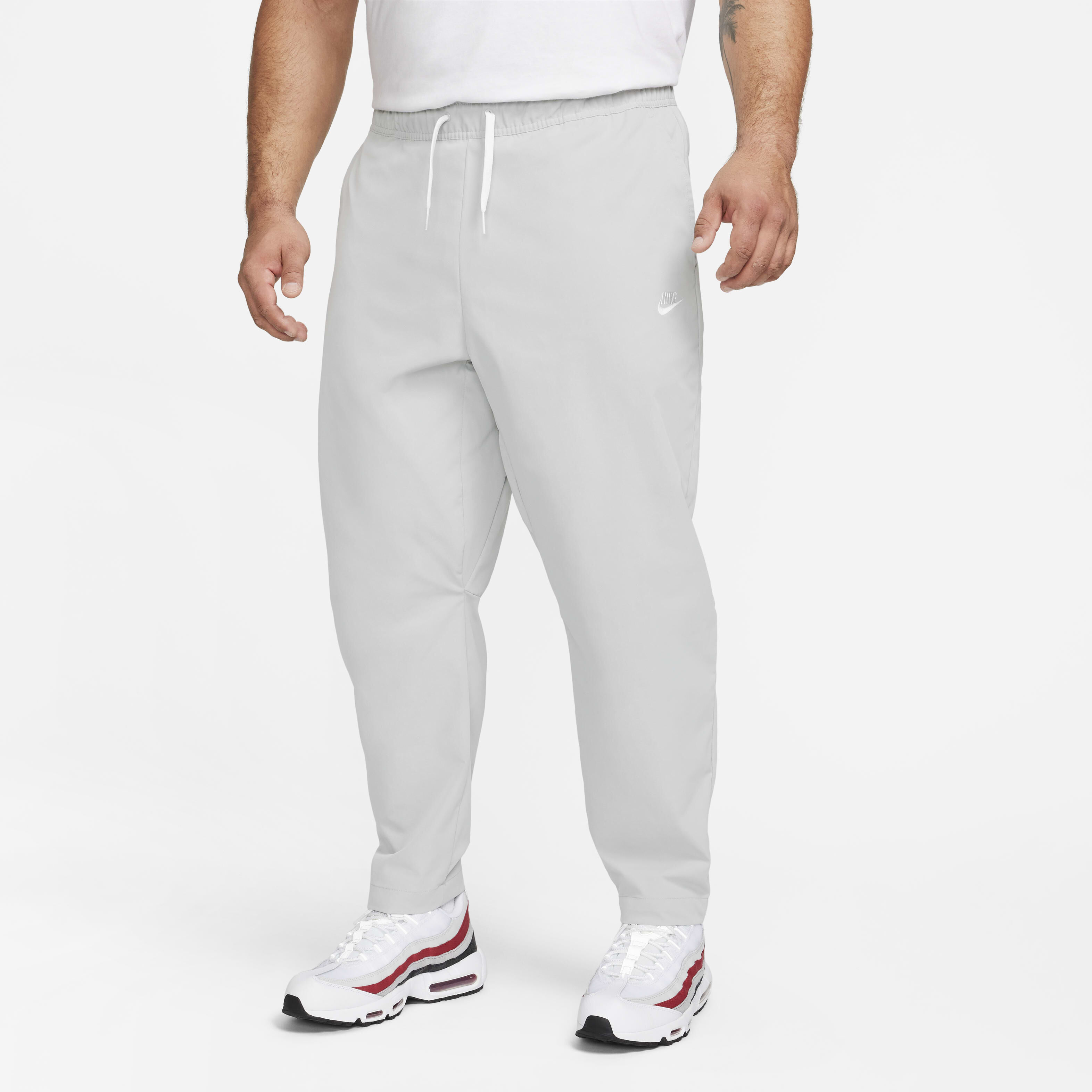 Buy Nike Club Men s Woven Tapered Leg Trousers Nike UAE Official