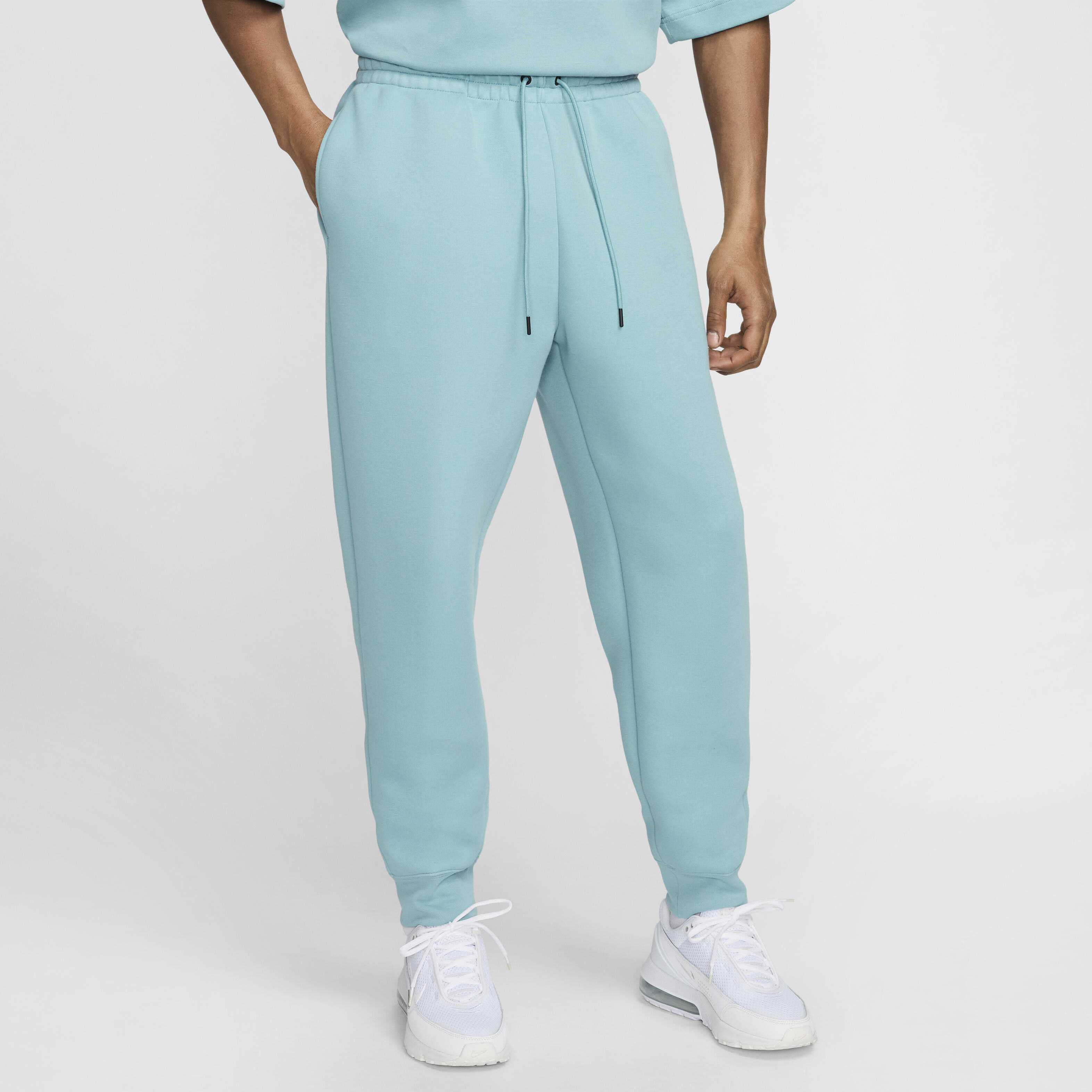 Blue nike tech pants store