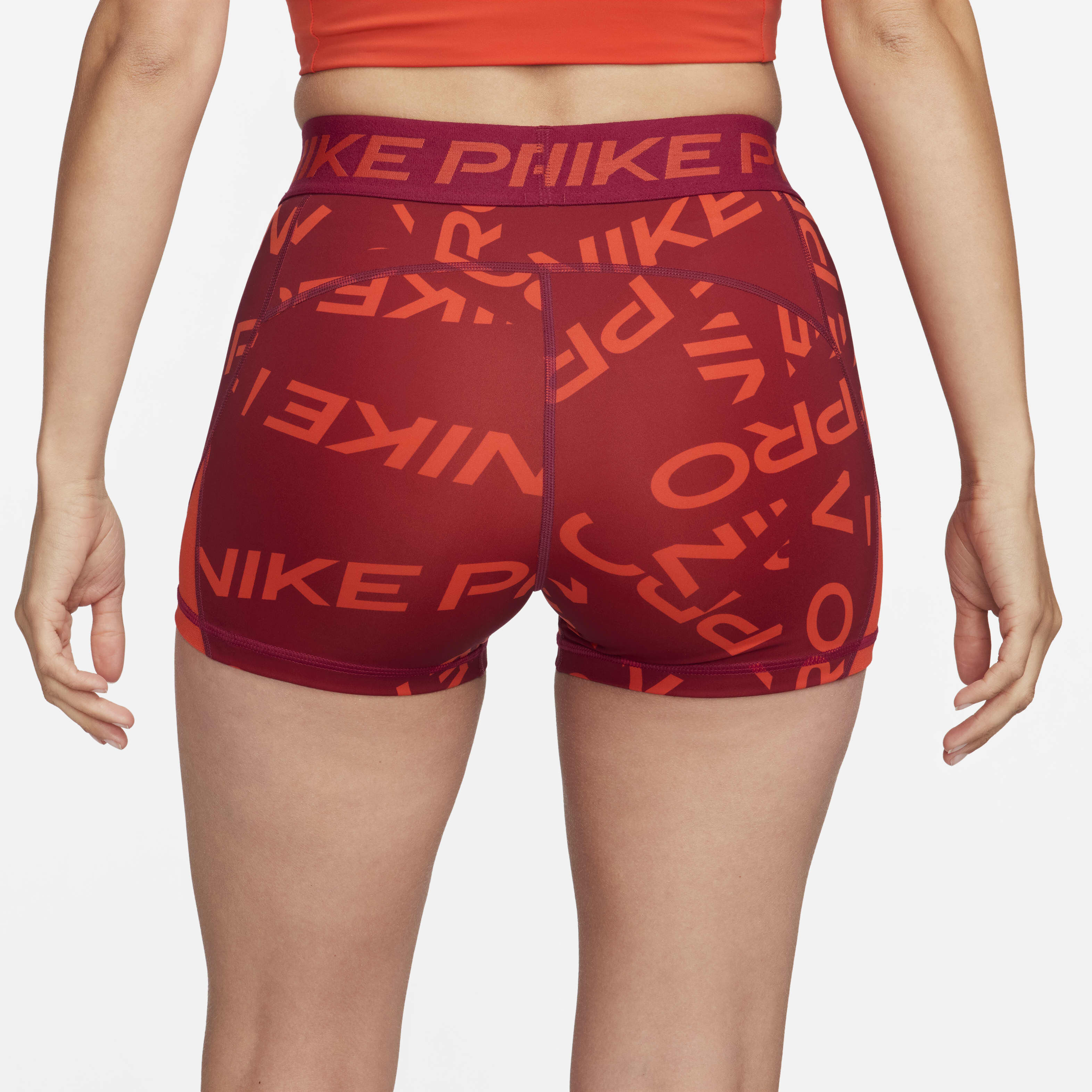 Buy Nike Pro Women s Mid Rise 8cm approx. Printed Shorts Noble Red Picante Red White Nike UAE Official