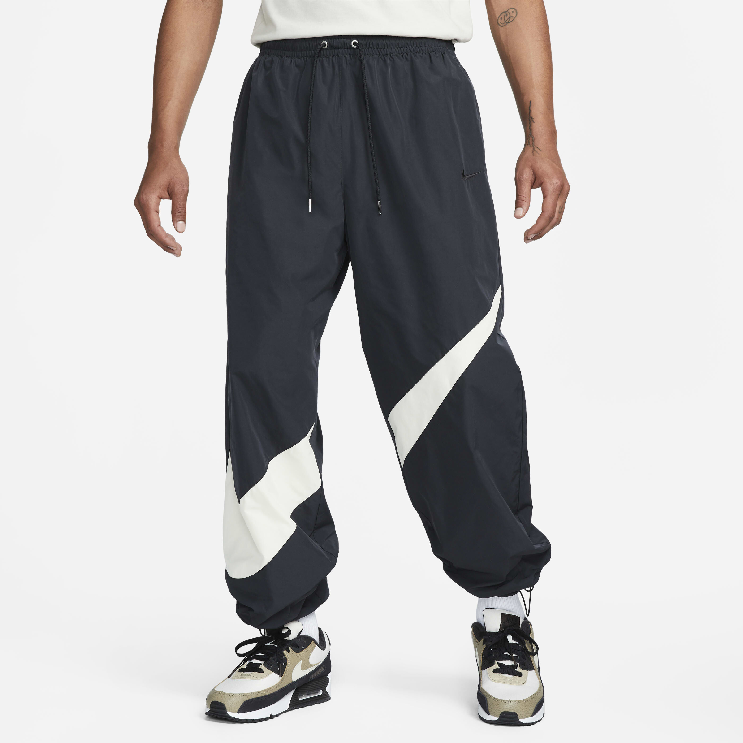 Nike black swoosh woven joggers hotsell