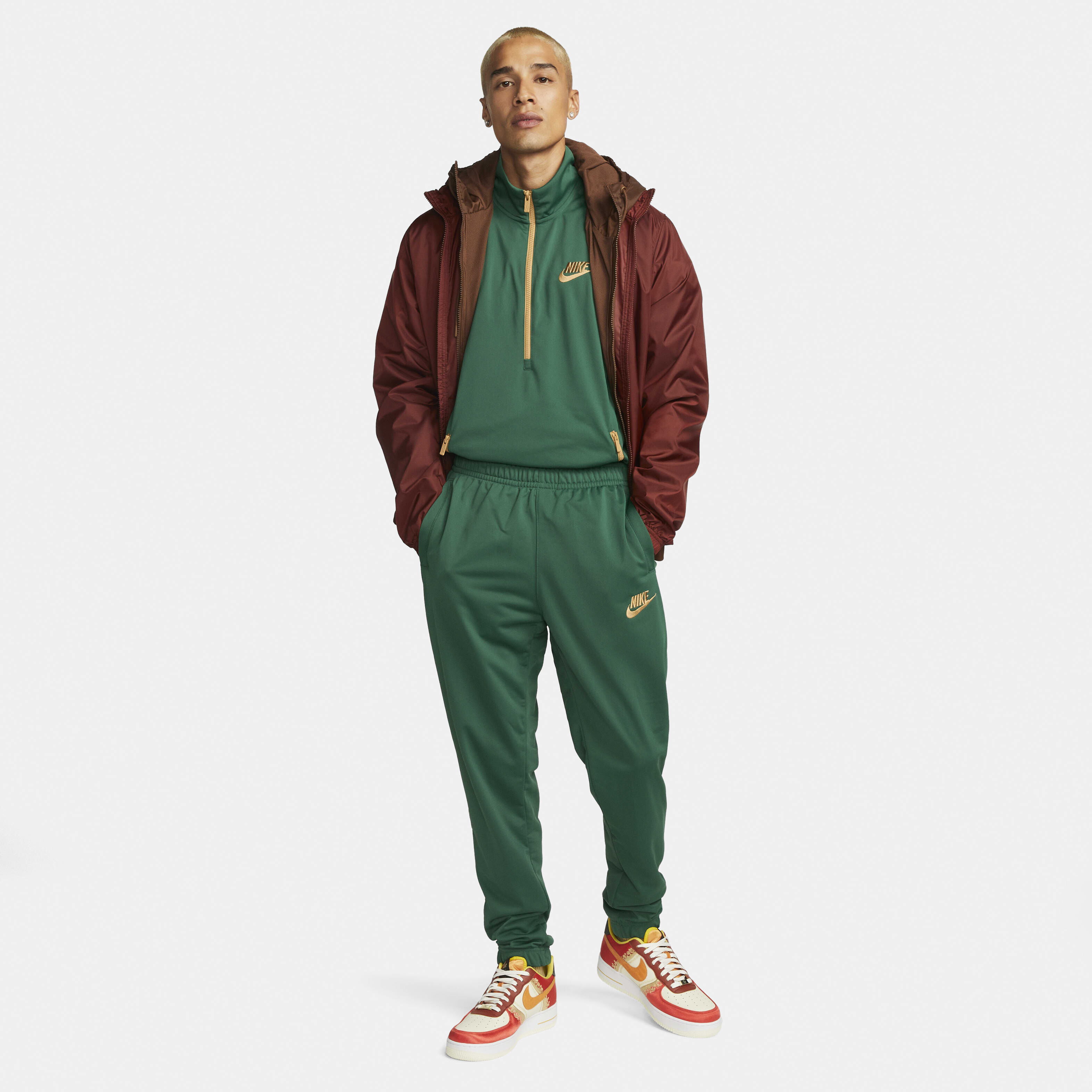 Buy Nike Sportswear Sport Essentials Men s Poly Knit Tracksuit Gorge Green Elemental Gold Nike UAE Official