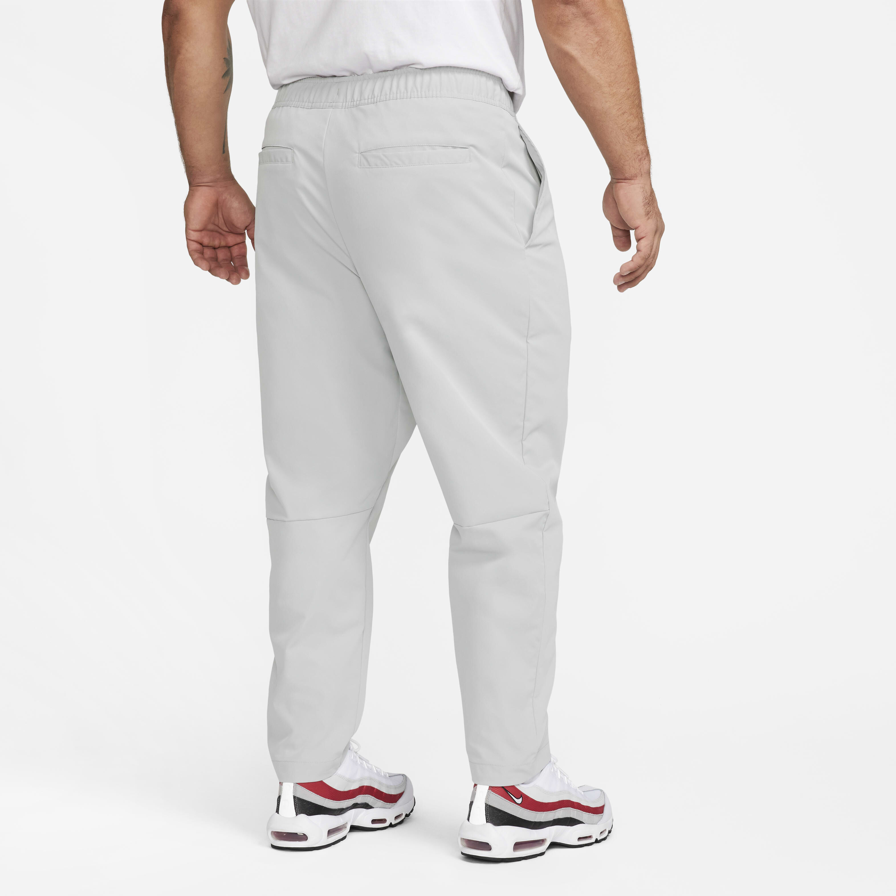 Buy Nike Club Men s Woven Tapered Leg Trousers Nike UAE Official