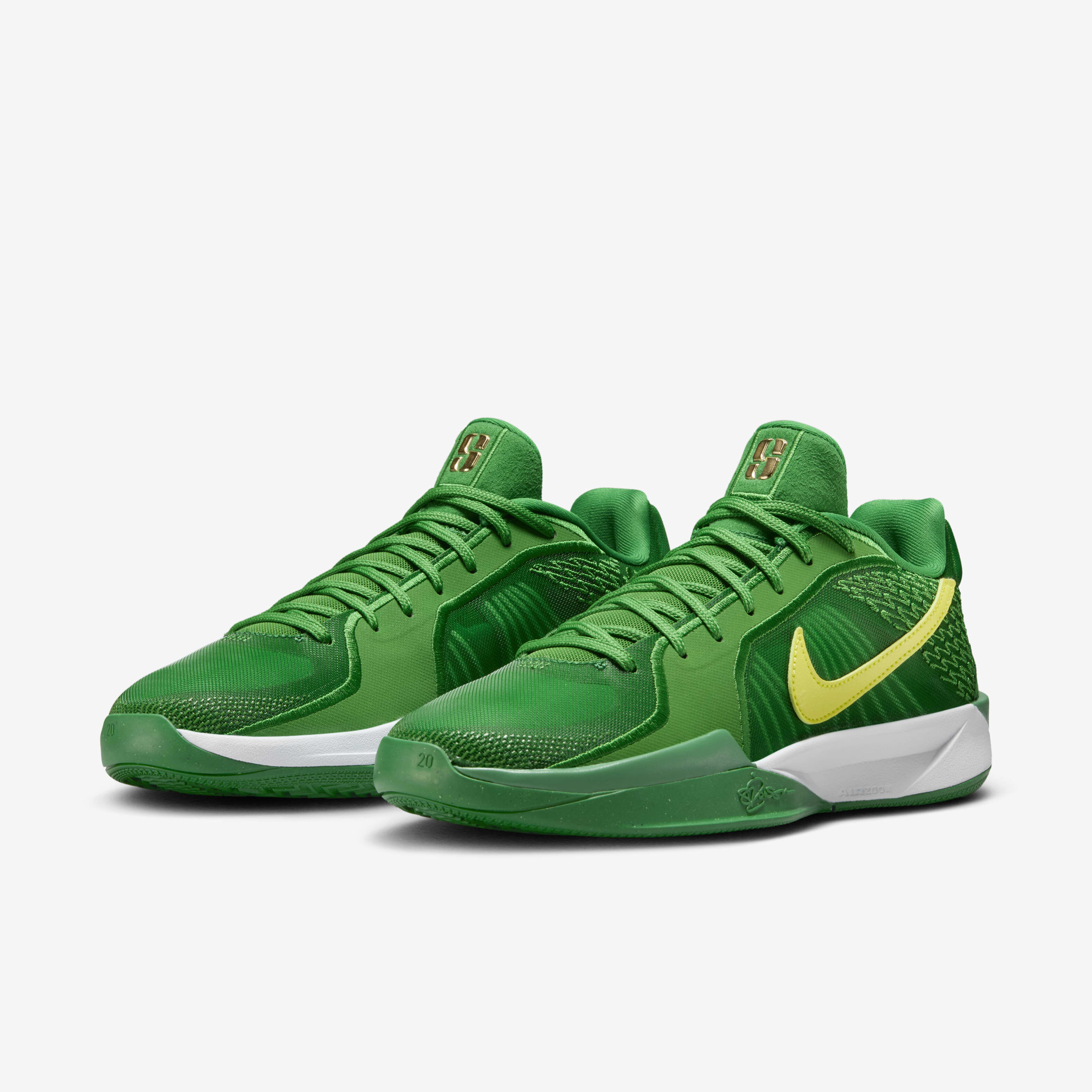 Yellow and green nike shoes top