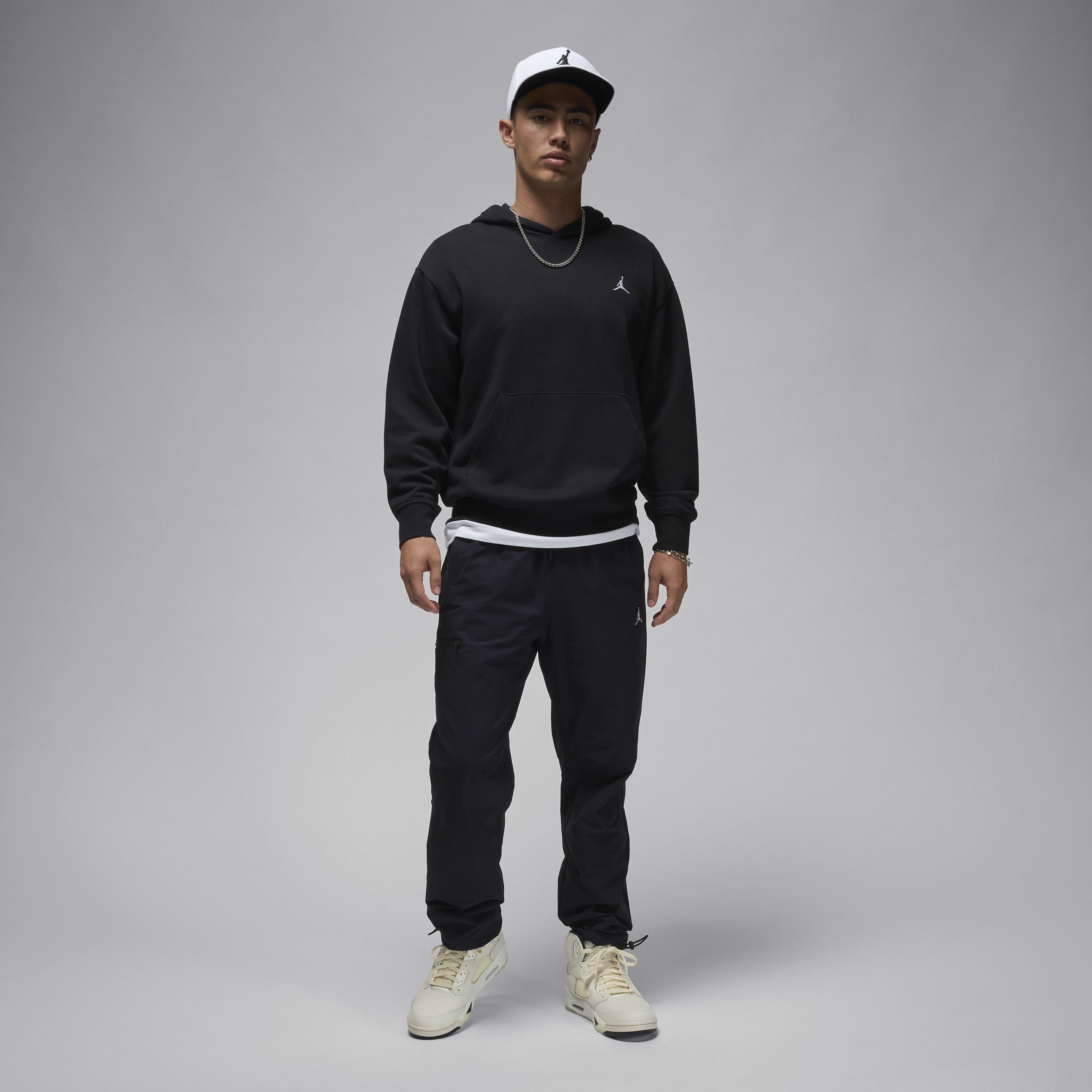 Buy Jordan Essential Men's Woven Trousers - Black/White @ Nike UAE