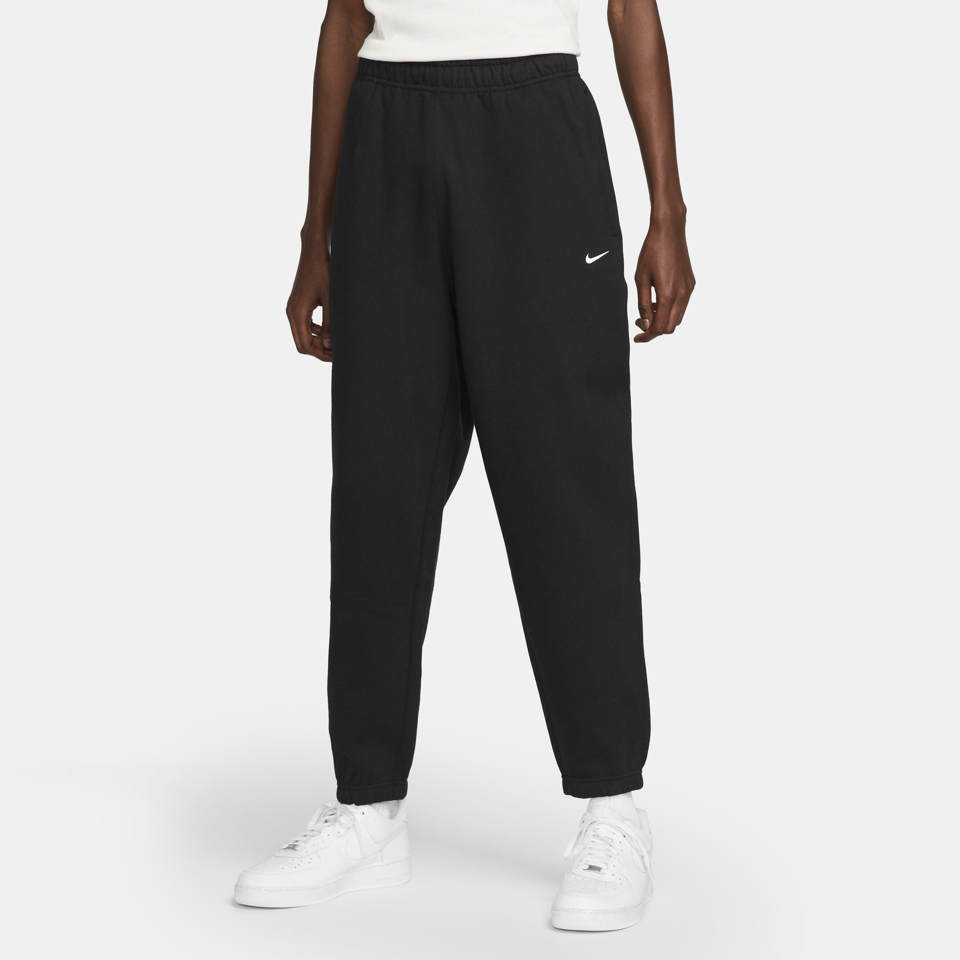 Nike swoosh jogging bottoms on sale