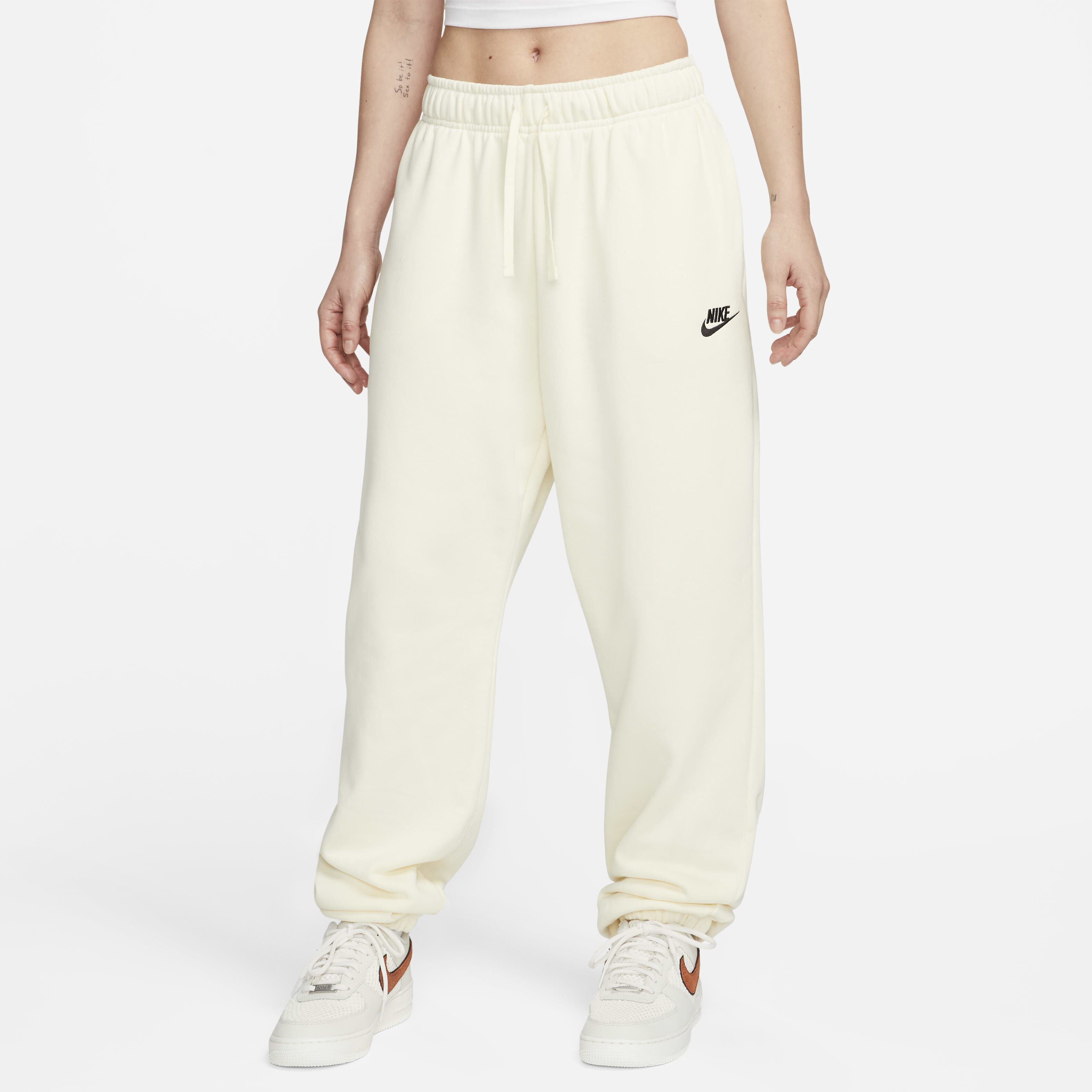 Buy Nike Sportswear Club Fleece Women s Mid Rise Oversized Tracksuit Bottoms Coconut Milk Black Nike UAE Official