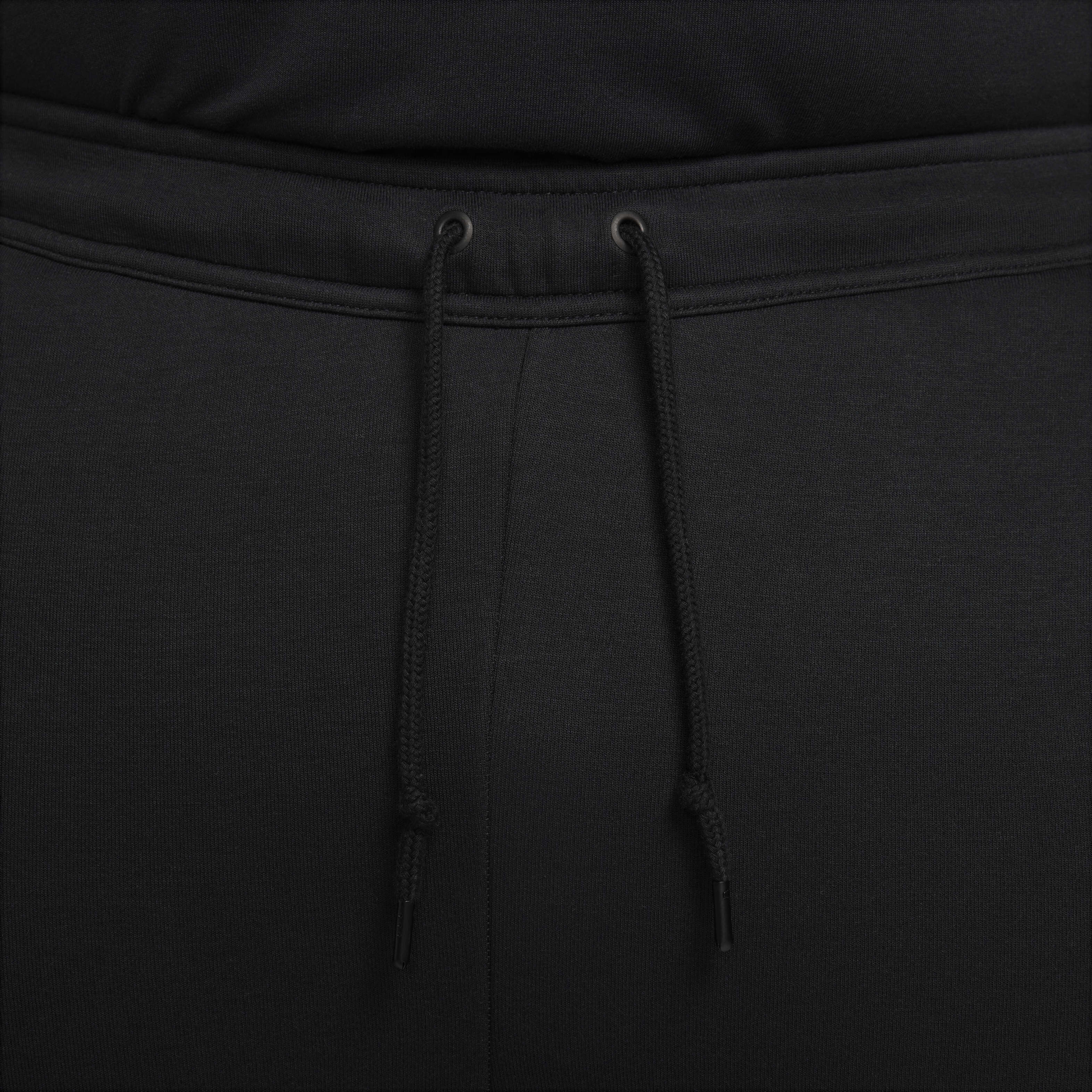 Nike slim fit black joggers on sale