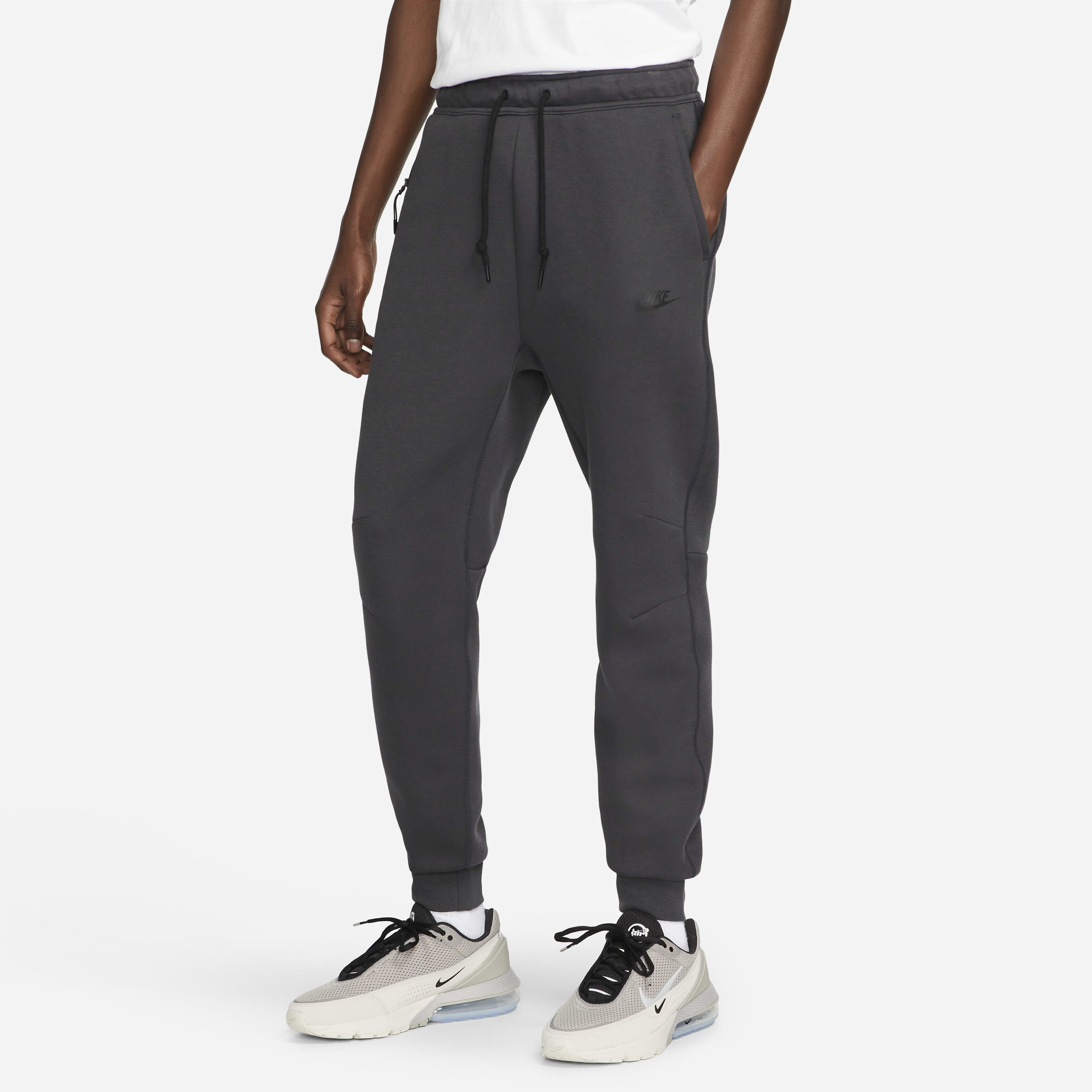 Dark grey nike tech joggers deals
