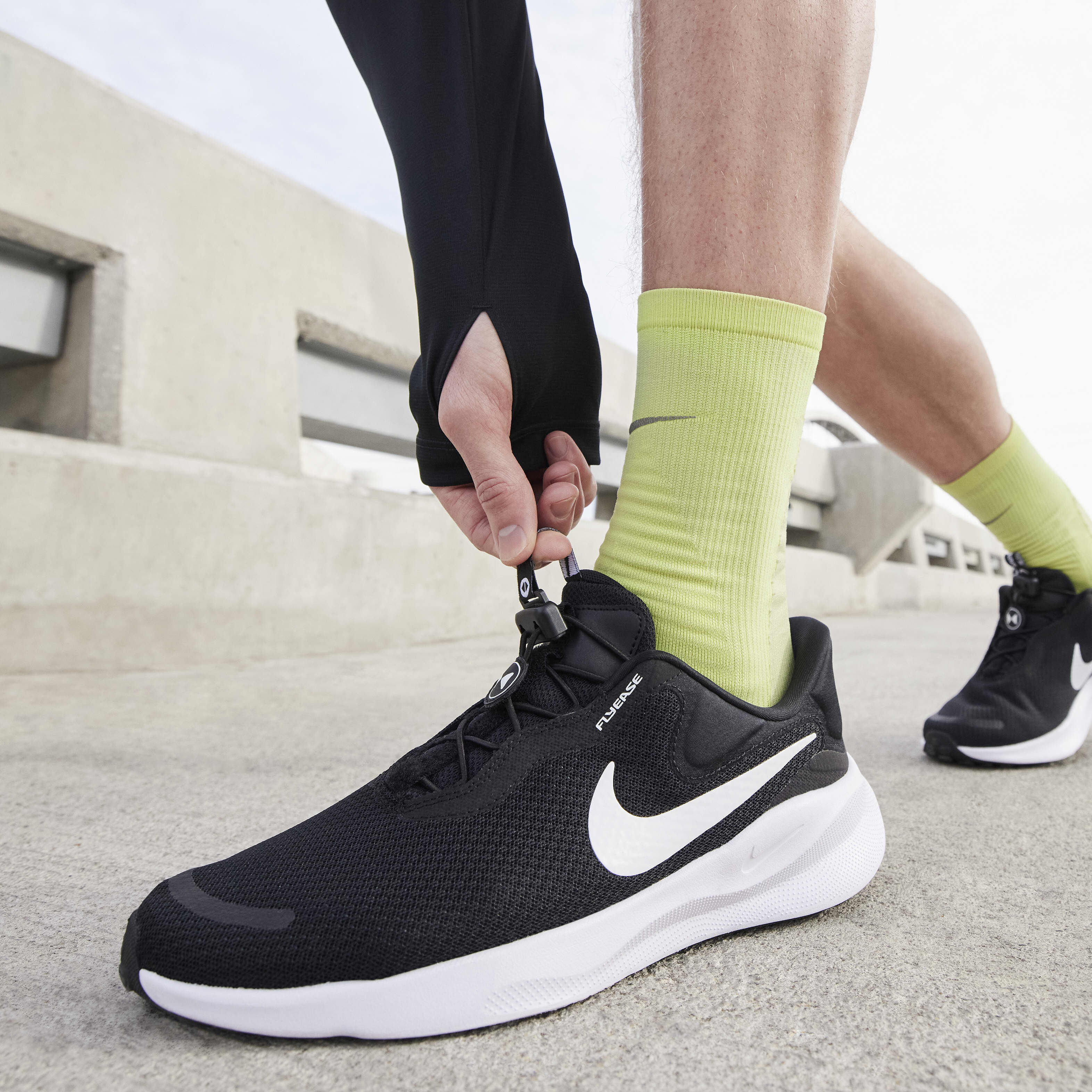 Buy Nike Revolution 7 EasyOn Men s Road Running Shoes Black White Nike UAE Official