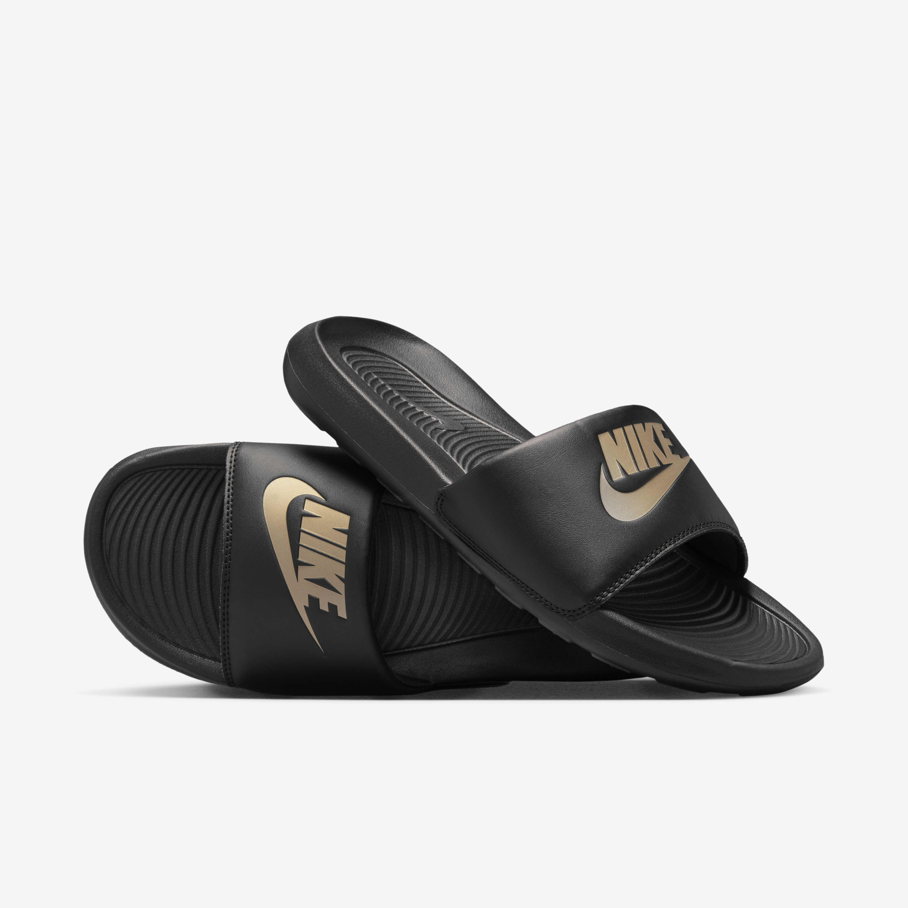 Buy Nike Victori One Men s Slides Black Black Metallic Gold Nike UAE Official