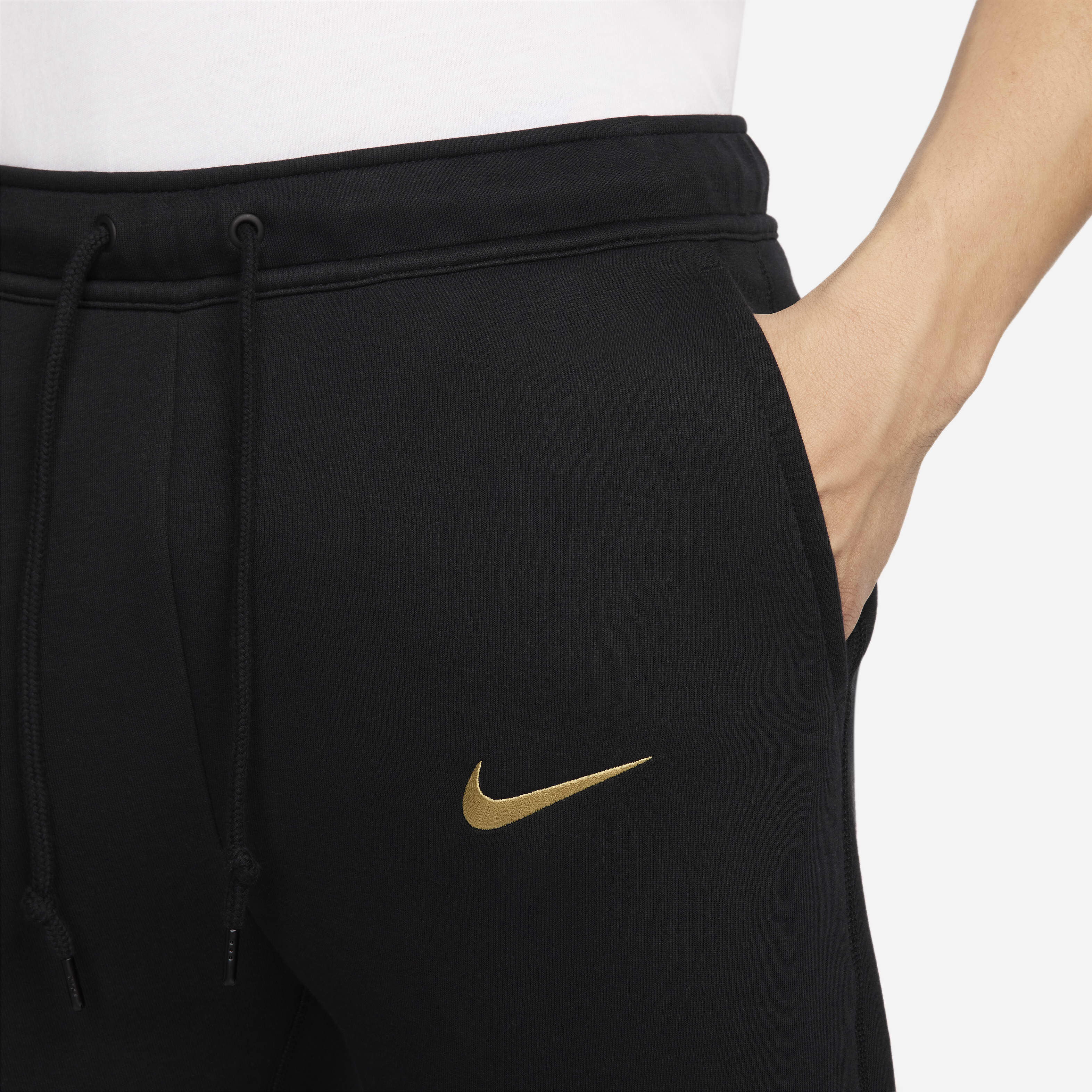 Nike joggers black and gold sale