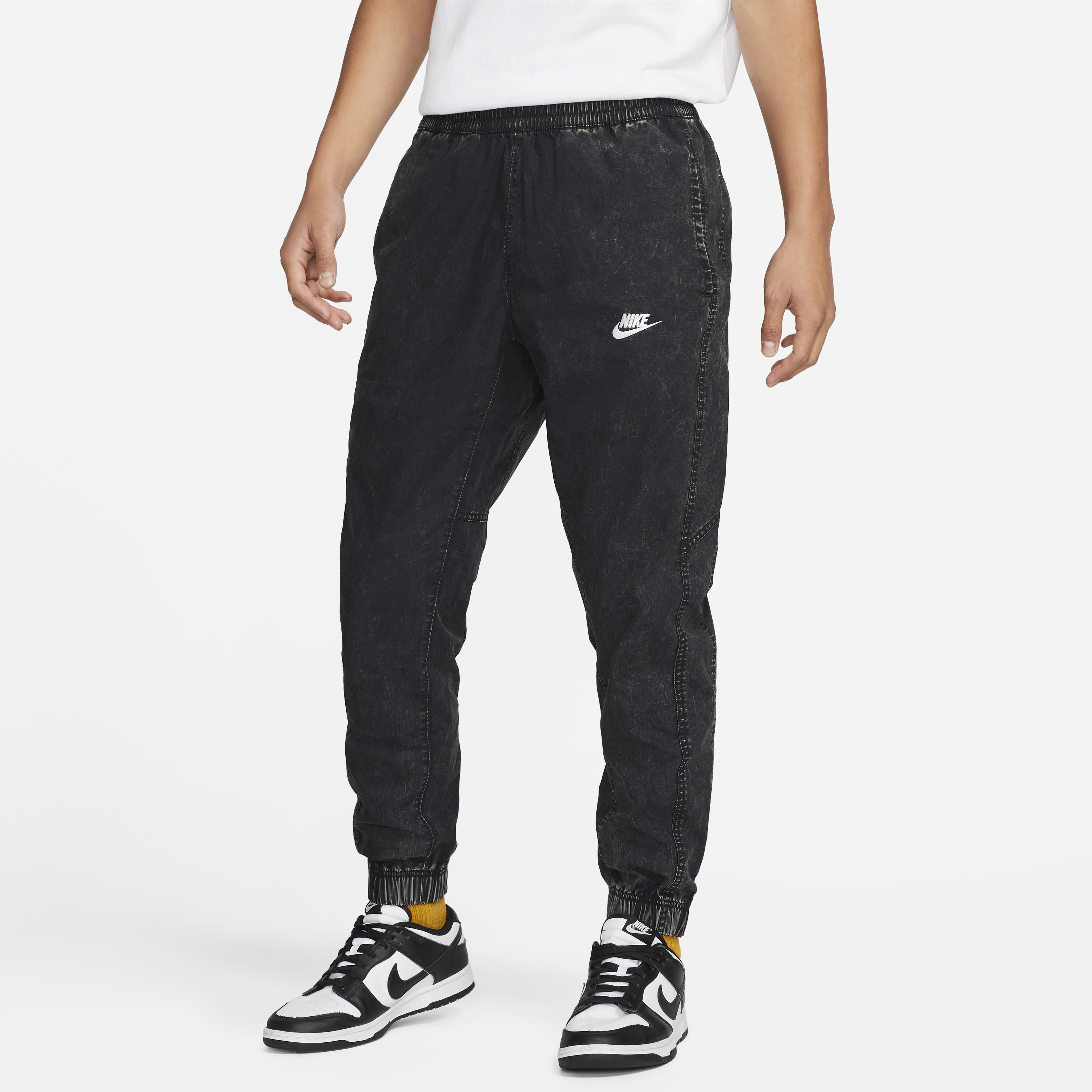 Buy Nike Club+ Men's Unlined Woven Joggers - Black/White @ Nike UAE