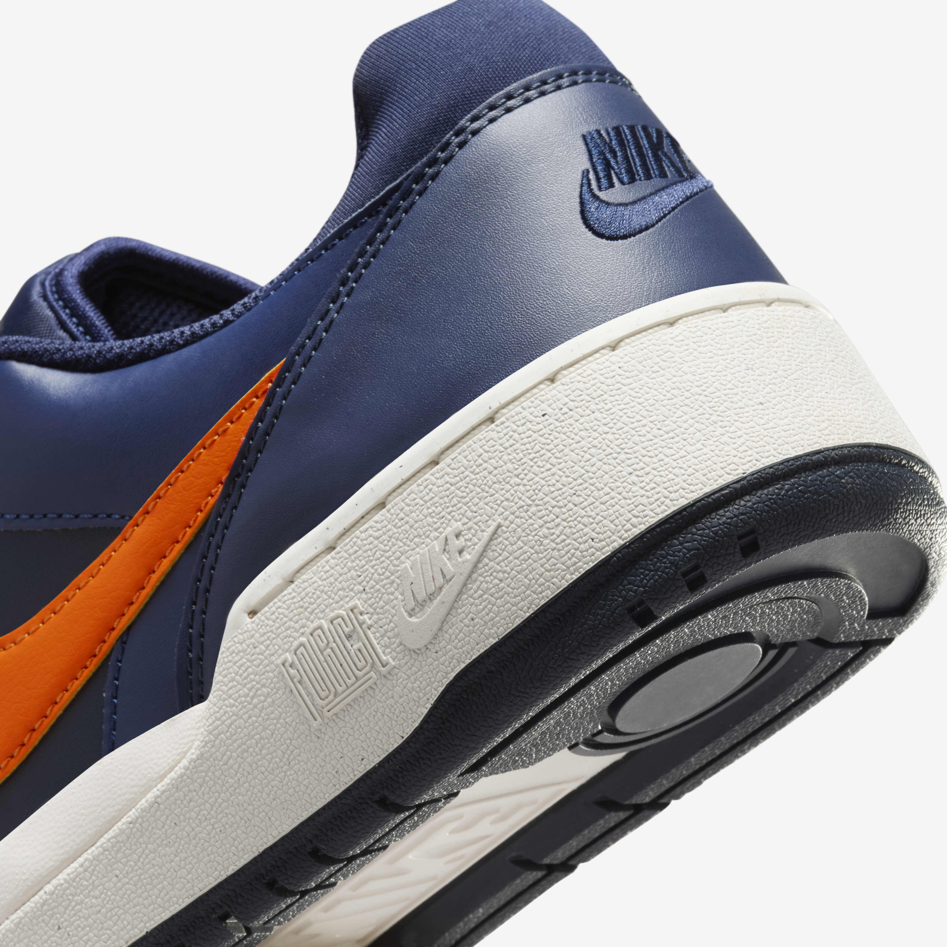 Navy and orange nike shoes discount
