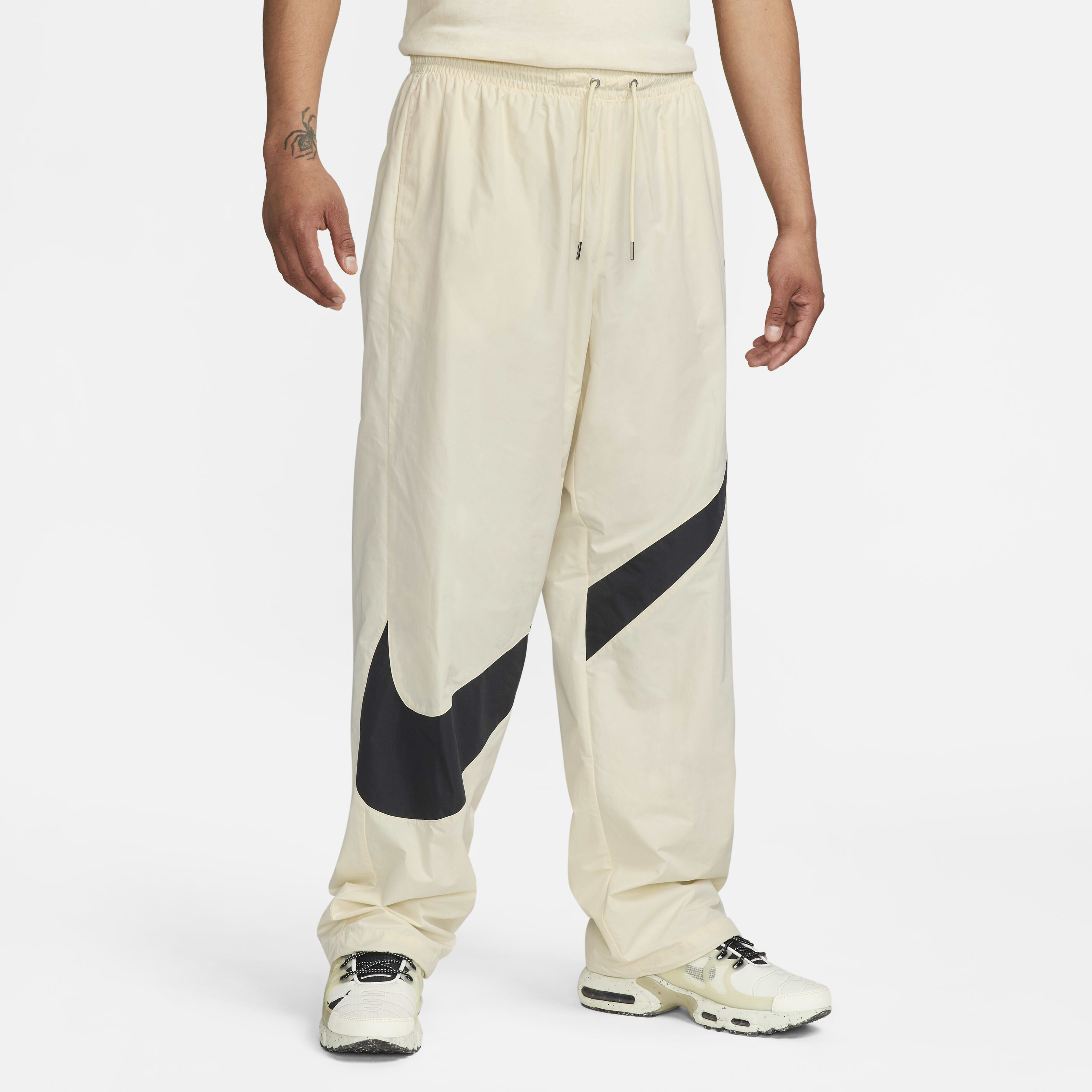 Buy Nike Swoosh Men s Woven Trousers Coconut Milk Black Coconut Milk Nike UAE Official