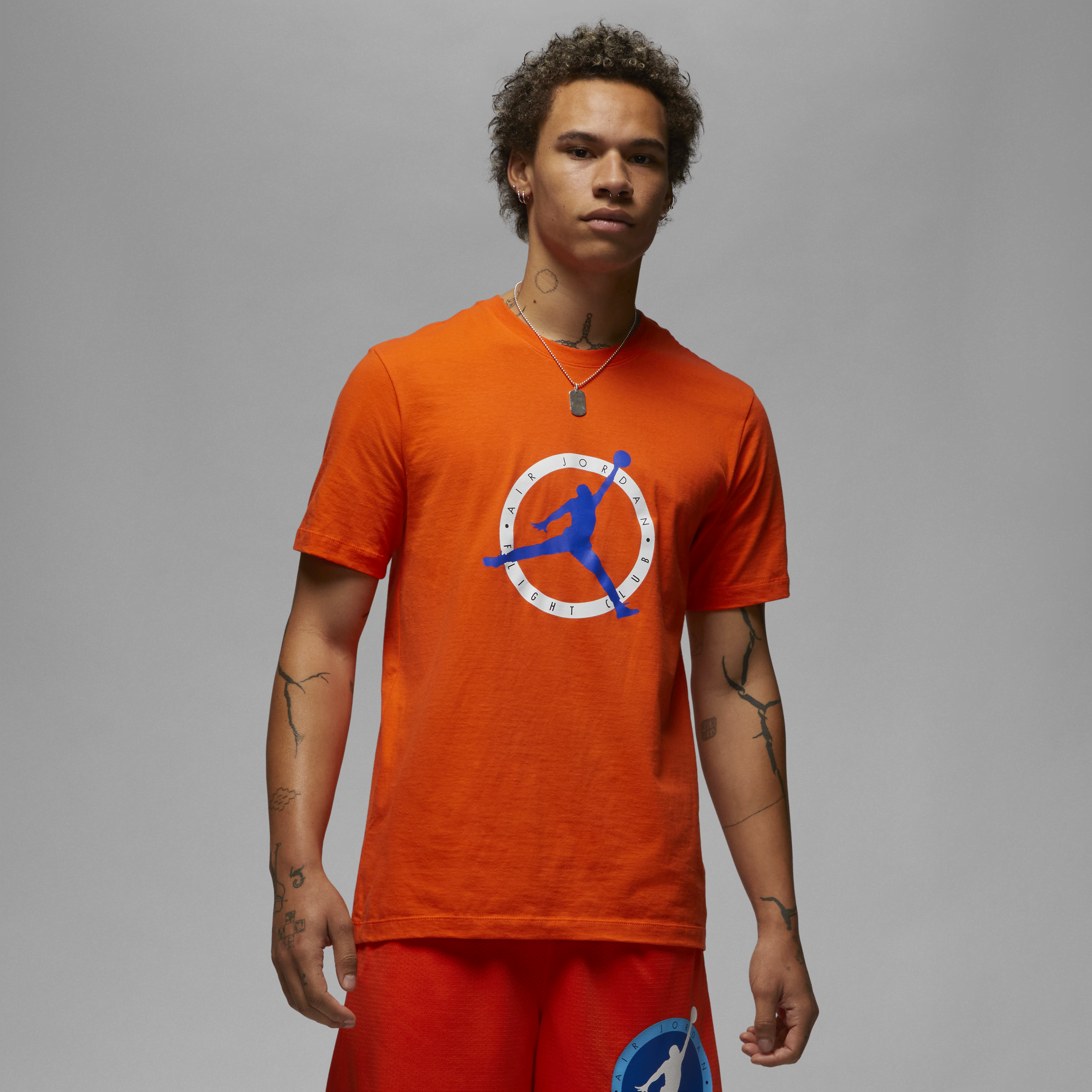 Orange and store green nike shirt