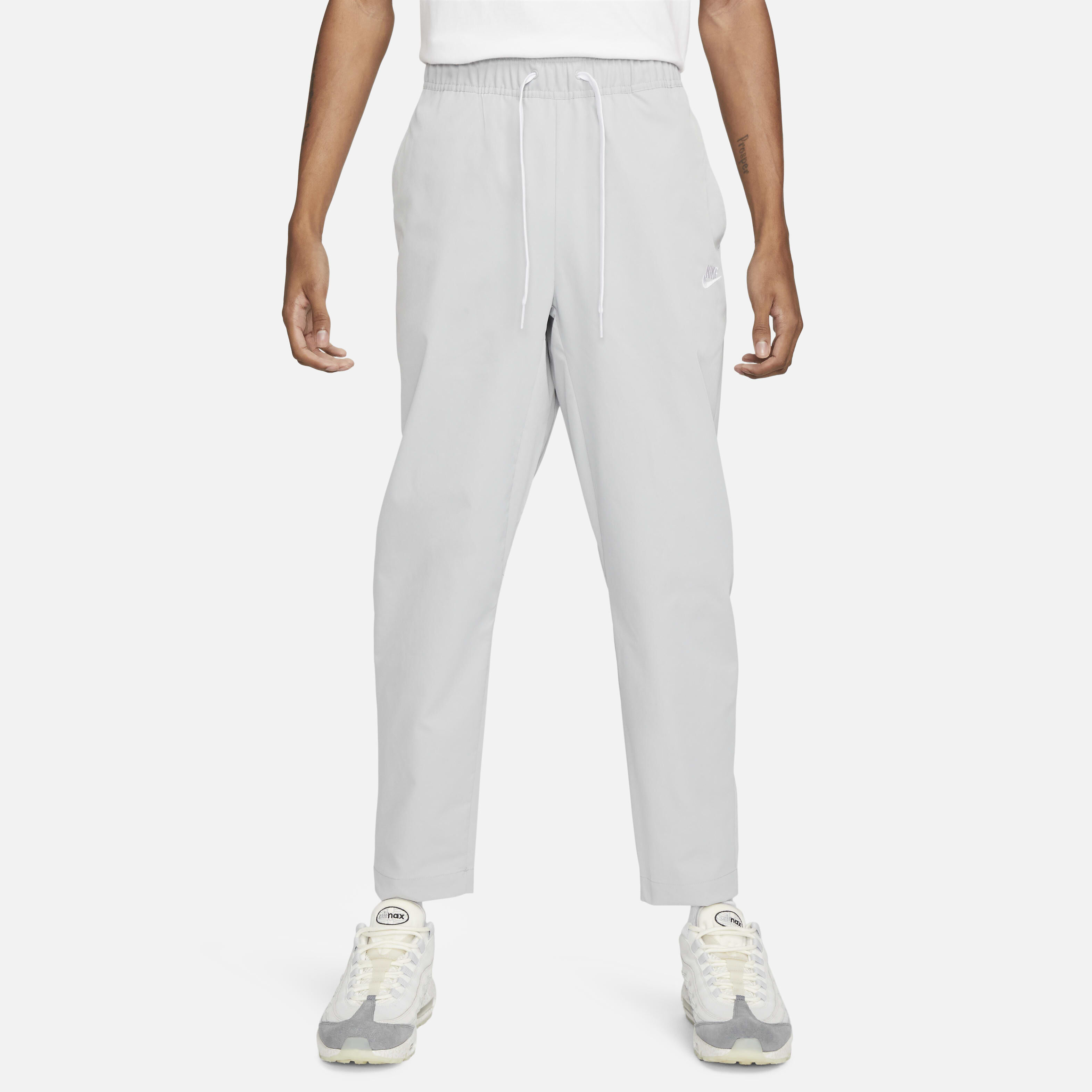Buy Nike Club Men s Woven Tapered Leg Trousers Nike UAE Official
