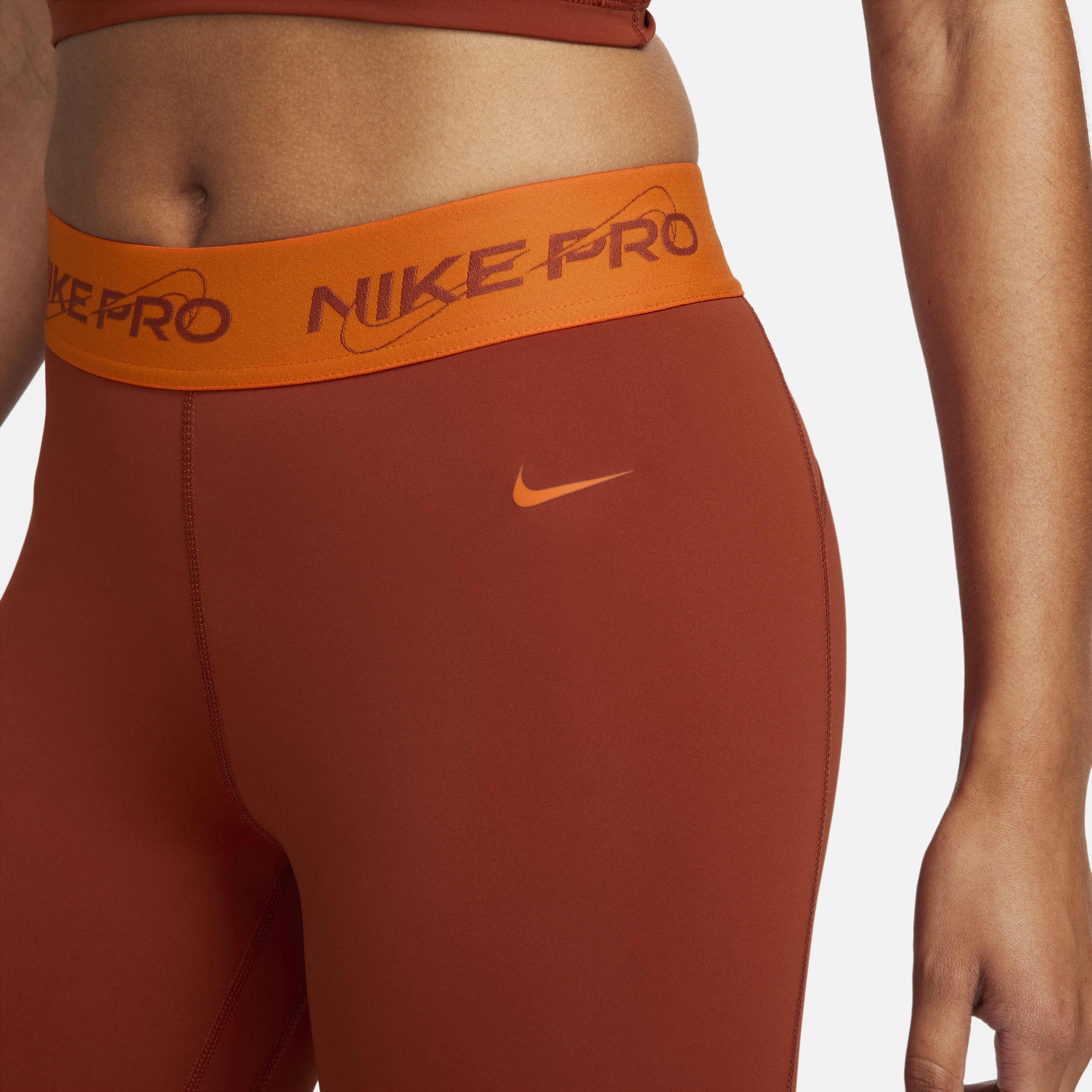 Orange and black nike leggings top