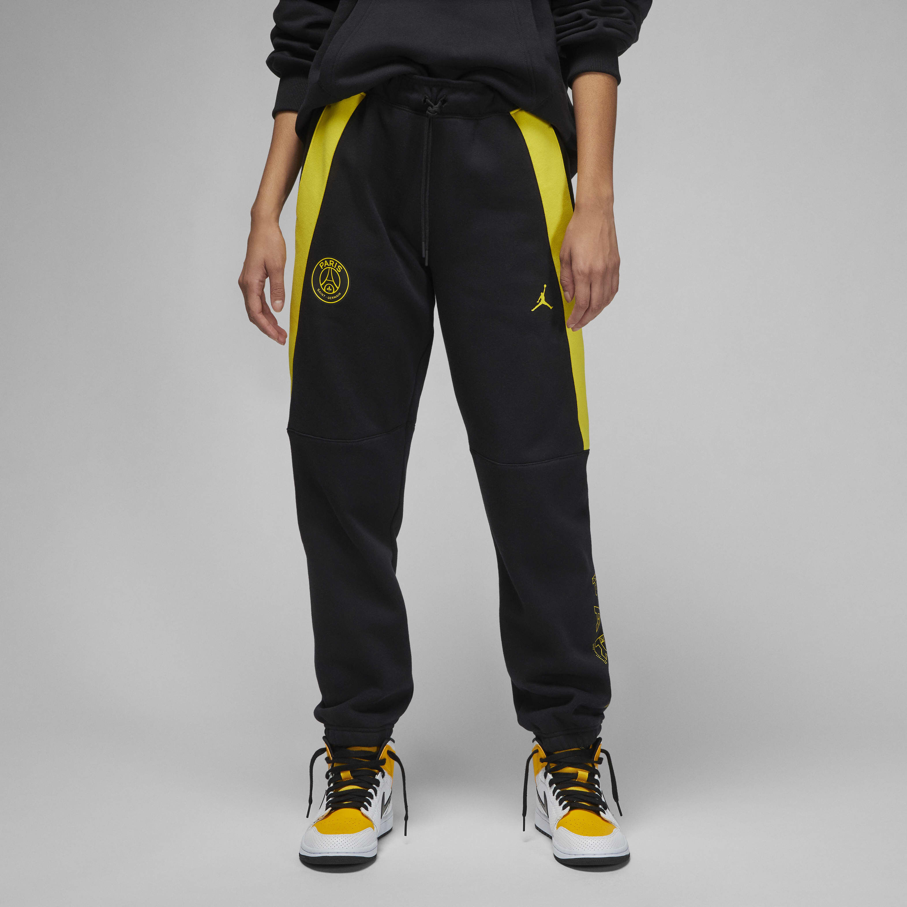 Buy Paris Saint Germain Women s Fleece Trousers Black Tour Yellow Tour Yellow Nike UAE Official