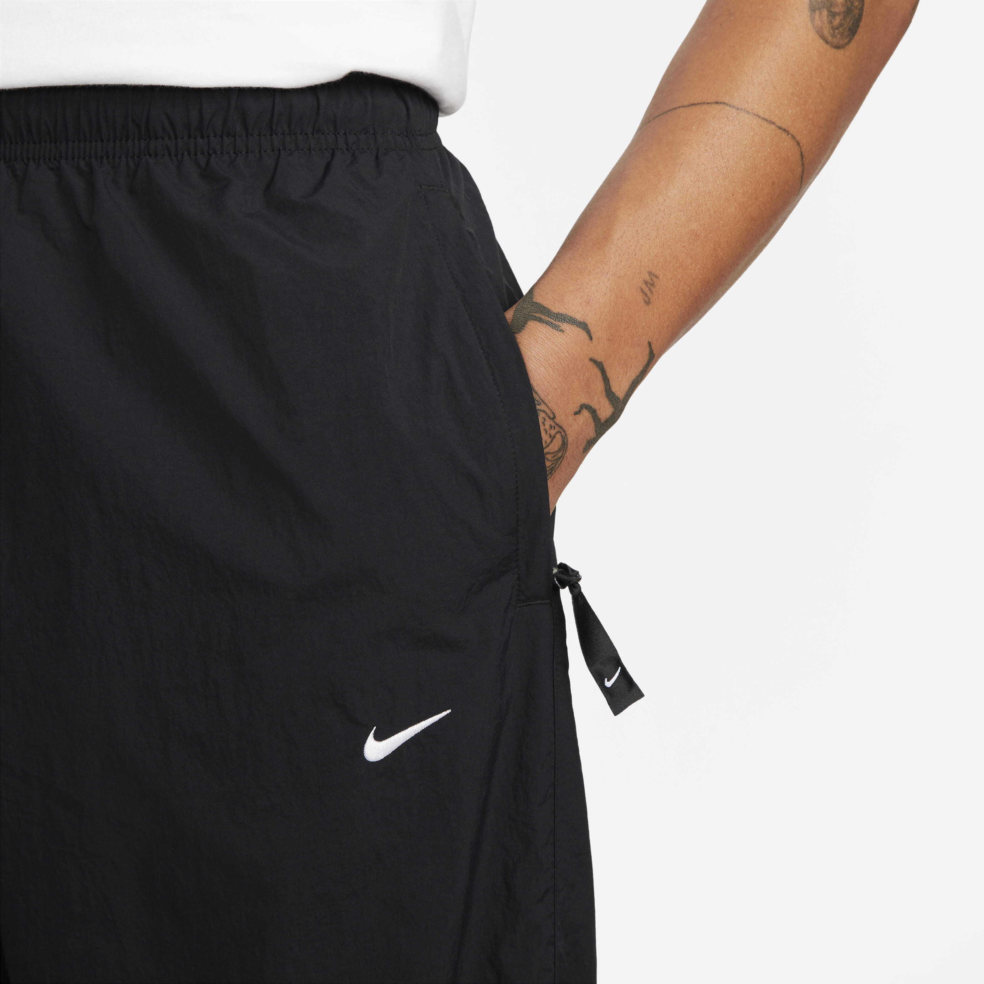 Swoosh tracksuit bottoms on sale