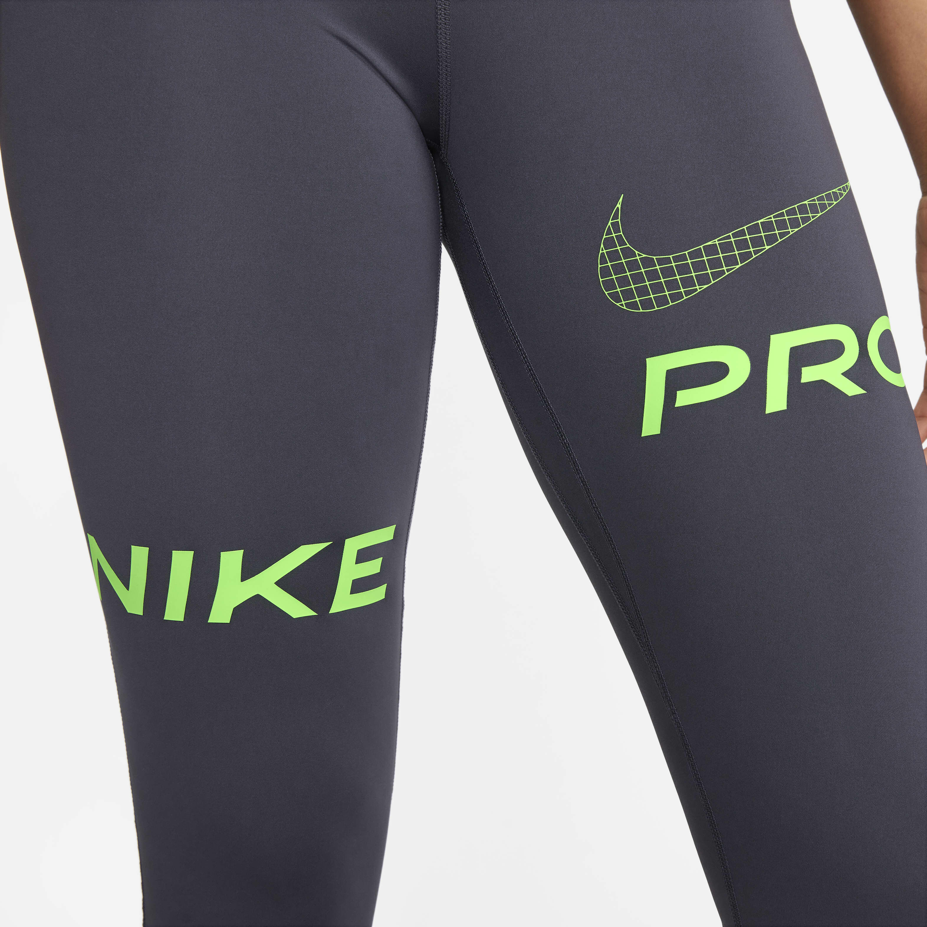 Buy Nike Pro Women s Mid Rise Full Length Graphic Training Leggings Gridiron Black Green Strike Nike UAE Official